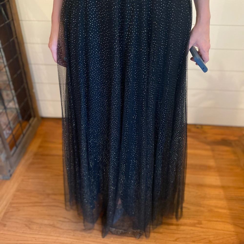 Black maxi dress with gold sparkles.